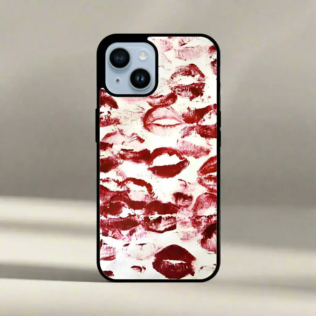 A glass phone case with a sublimation print of red lip marks, designed for a smartphone.